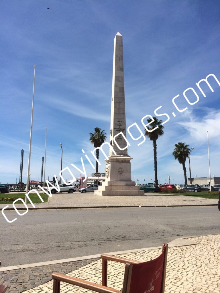 The image of the obelisk that is situated in the marine area of Faro Portugal